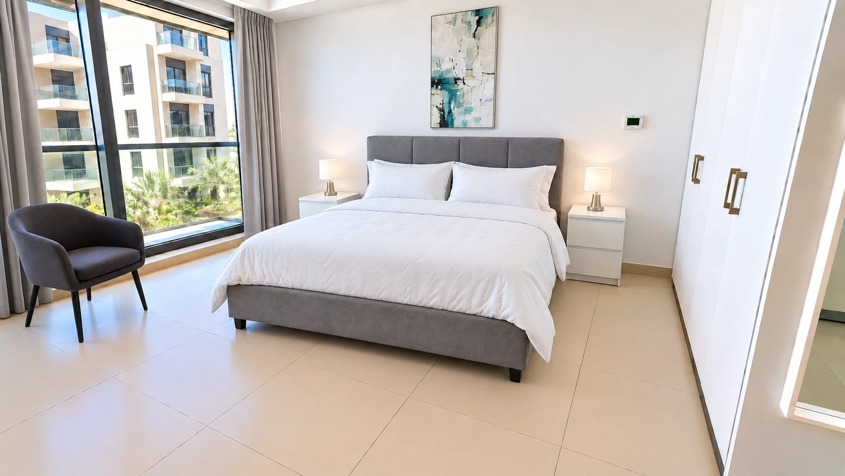 The same bedroom with Basic Airbnb: bedding, curtains, bedside lamps and art.